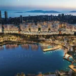 A modern, open-plan living area in a residential development in Kartal, Istanbul, featuring large windows overlooking a scenic natural lake, illustrative of the investment apartments for sale.